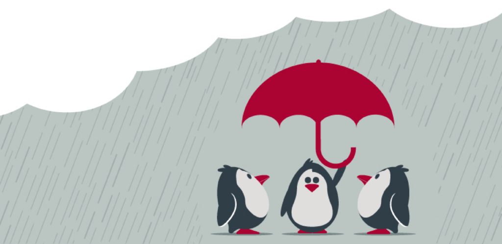Three penguins under an umbrella