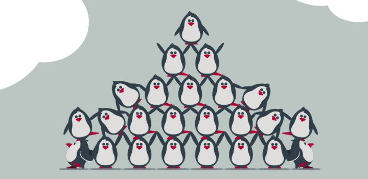 Group of penguins in human pyramid style formation