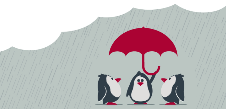 Penguins under an umbrella